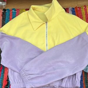 purple and yellow cropped zip up.